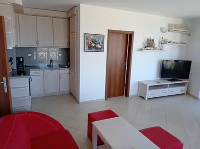 a room with a kitchen and a living room at Oasis Beach 2 bedroom apartment in Lozenets
