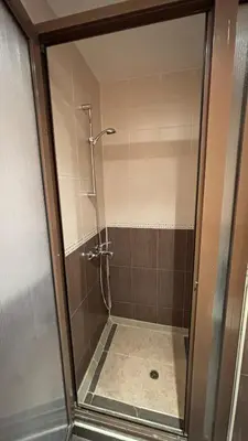 a shower with a glass door in a bathroom at One bedroom Apartment in Sunny Beach