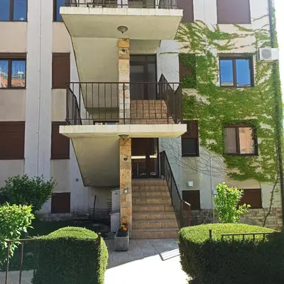 a building with a spiral staircase in front of a building at Dolce Vita 1 Infinity Love in Sveti Vlas