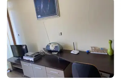 a desk with a computer and a monitor on it at Central Beach Apartament in Sunny Beach