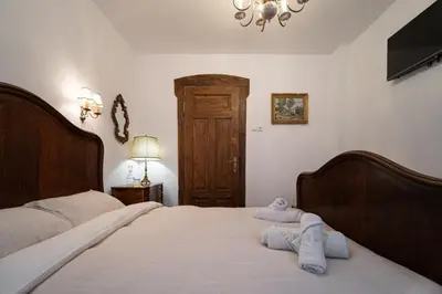 a bedroom with two beds with towels on them at Beehive Hotel and CoWorking in Varna City