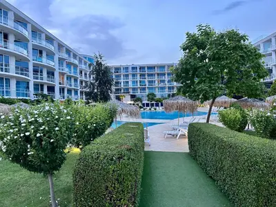 a resort with a swimming pool and a building at Atlantis Resort & 4 swimming pools & Spa & Апартамент in Burgas City