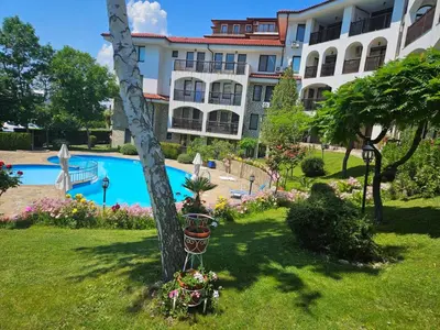 a resort with a swimming pool and a building at DELFIN Penthouse amazing view in Sveti Vlas