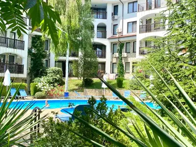 an apartment with a swimming pool in a building at DELFIN Penthouse amazing view in Sveti Vlas