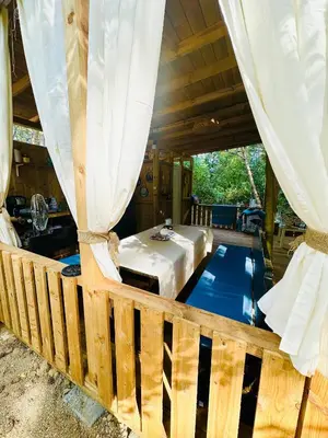 a bedroom with a bed and a bed at Каравана Синята Маймуна плаж Градина # RV Blue Monkey on the beach in Chernomorets
