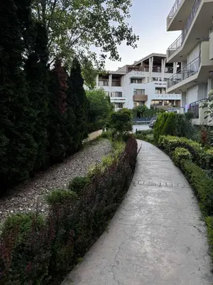 a path in front of a apartment building at Студио 310 на първа линия in Chernomorets
