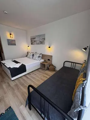 a bedroom with two beds in a room at Студио 310 на първа линия in Chernomorets