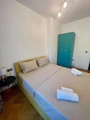 a bedroom with a bed with two towels on it at Varna city Park Apartament in Varna City