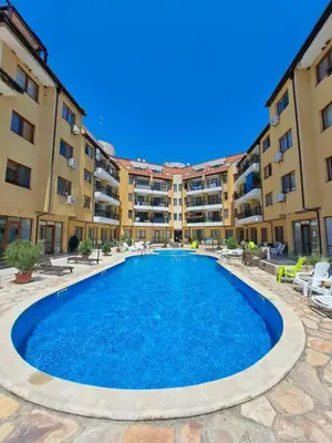 a swimming pool in front of a apartment building at Lidda Relax in Oasis Beach Kamchia in Bliznatsi
