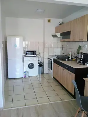 a kitchen with a white refrigerator and a dishwasher at Васил Левски 61 in Burgas City