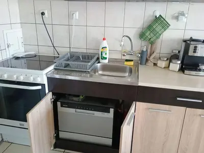 a small kitchen with a sink and a stove at Васил Левски 61 in Burgas City