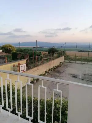 a view of a basketball court from a balcony at Апартаменти Захариеви 4 in Byala