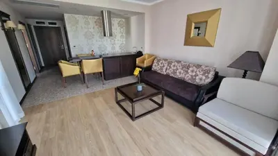 a living room with a couch and a table at Apartment in Royal Beach Barcelo in Sunny Beach