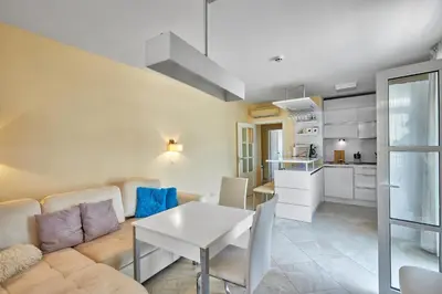 a living room with a couch and a table at 2BD Flat with Balcony in Flores Garden Complex by Flat Mаnаger in Chernomorets