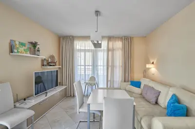 a living room with a couch and a table at 2BD Flat with Balcony in Flores Garden Complex by Flat Mаnаger in Chernomorets