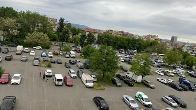a parking lot filled with lots of parked cars at Aurora Sea Breeze in Burgas City