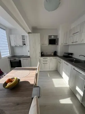 a kitchen with a table with a banana on it at Tei-Zi apartments2 in Burgas City