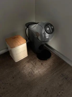 a hair dryer sitting next to a box in a room at Tei-Zi apartments2 in Burgas City