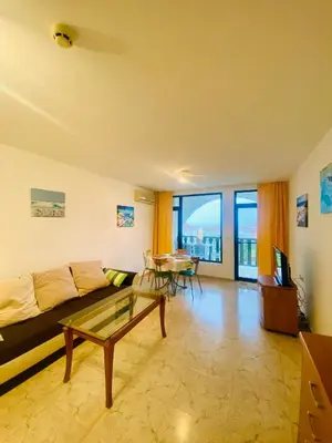 a living room with a couch and a table at Cozy apartment in Kambani 1 in Sveti Vlas