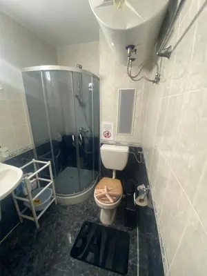 a bathroom with a shower and a toilet and a sink at Cozy apartment in Kambani 1 in Sveti Vlas