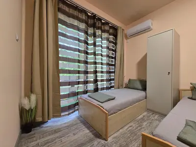 a small room with a bed and a window at Ах, морето !!! in Tsarevo