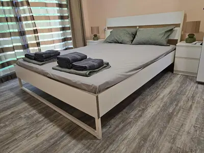 a bed with two towels on top of it at Ах, морето !!! in Tsarevo