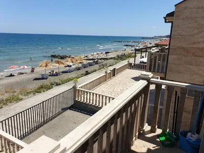 a view of the beach from the balcony of a condo at Solar Rise apartment in Pomorie