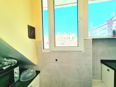 a bathroom with a large window and a shower at Two-Floor Sunny Apartment in City Centre in Burgas City