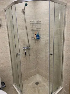a shower with a glass shower stall in a bathroom at Sunny holidays in Byala
