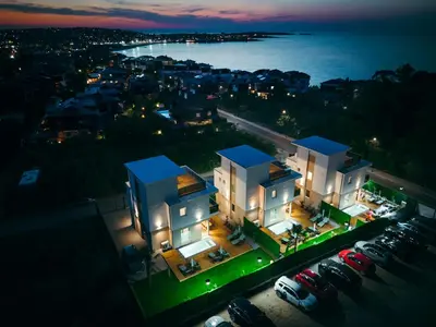 an aerial view of a house with a parking lot at Paradise villas in Sozopol