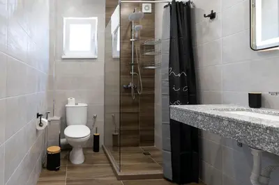 a bathroom with a shower and a toilet and a sink at Paradise villas in Sozopol