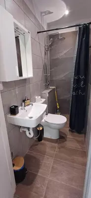 a bathroom with a sink and a toilet and a shower at Paradise villas in Sozopol