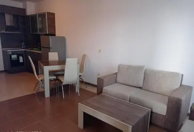 a living room with a couch and a table at Студио Море in Chernomorets