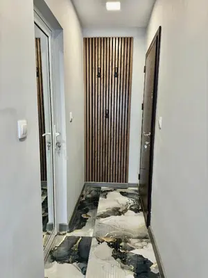 a hallway with a damaged floor and a mirror at Студио СВЕТИ ВЛАС 2 in Sveti Vlas