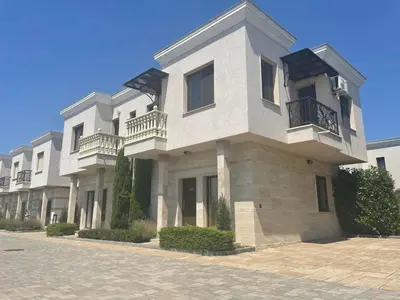 a large white building with balconies on a street at Majestic Villas Pomorie Park in Sarafovo