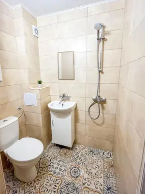 a bathroom with a toilet and a shower at Cosy Home in Burgas City