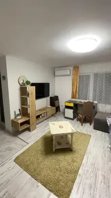 a living room with a couch and a table at Studio Kikki Sozopol in Sozopol