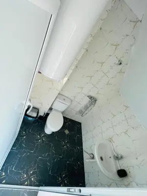 a dirty bathroom with a toilet and a sink at Apartments Lozenets in Lozenets