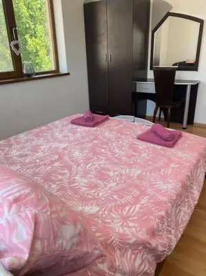 a pink bed with pink pillows on top of it at 2 Bedroom Apartment at Kasandra in Sunny Beach