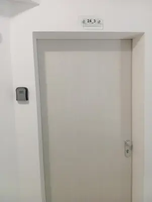 a door with a clock on top of it at Victoria's apartments -Marina Cape - Aheloy in Aheloy