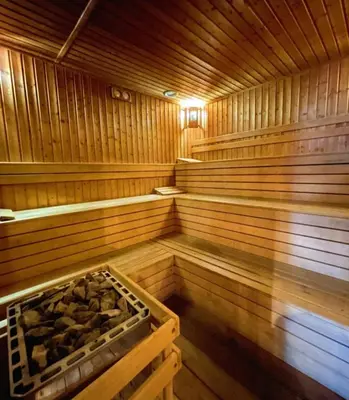 a empty wooden sauna with a bench in it at Victoria's apartments -Marina Cape - Aheloy in Aheloy
