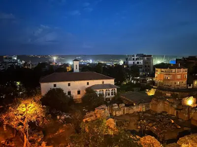 a view of a city at night at Roman Thermae Heritage Penthouse with Garage in Varna City