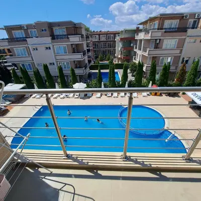 a swimming pool on the roof of a building at Студио Дарис in Nesebar