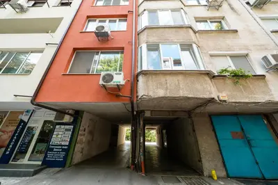 an alleyway leading to a building in a city at Boris Garden Comfort Suite in Burgas City