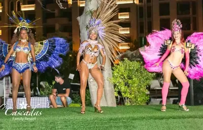 three women in costumes standing on the grass at Cascadas pool view luxury apartment Sunny beach in Sunny Beach