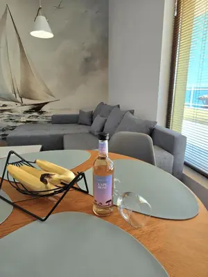 a bottle of alcohol sitting on top of a table at Апартамент 