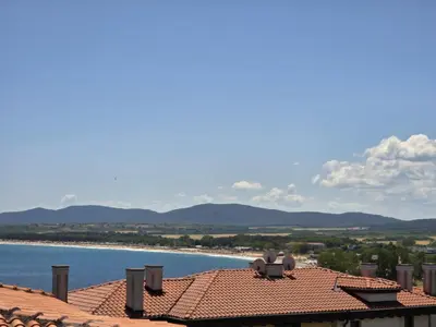 a view of the ocean from the roof of a house at Апартамент 