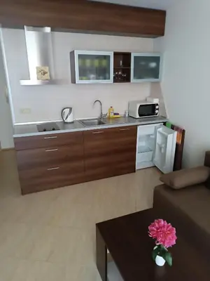a small kitchen with a sink and a microwave at MIDIA Family Resort - studio s výhledem na moře in Aheloy