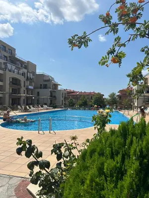 a large swimming pool in a city with buildings at Sveti vlas apartament Sorrento Sole Mare V&D Luxury Style Apartment Свети-влас апартамент студио in Sveti Vlas