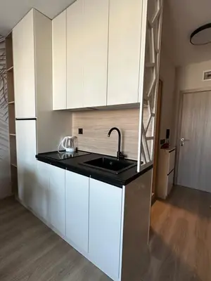 a kitchen with white cabinets and a sink at Sveti vlas apartament Sorrento Sole Mare V&D Luxury Style Apartment Свети-влас апартамент студио in Sveti Vlas